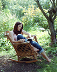 Picture of woman reading in a garden.